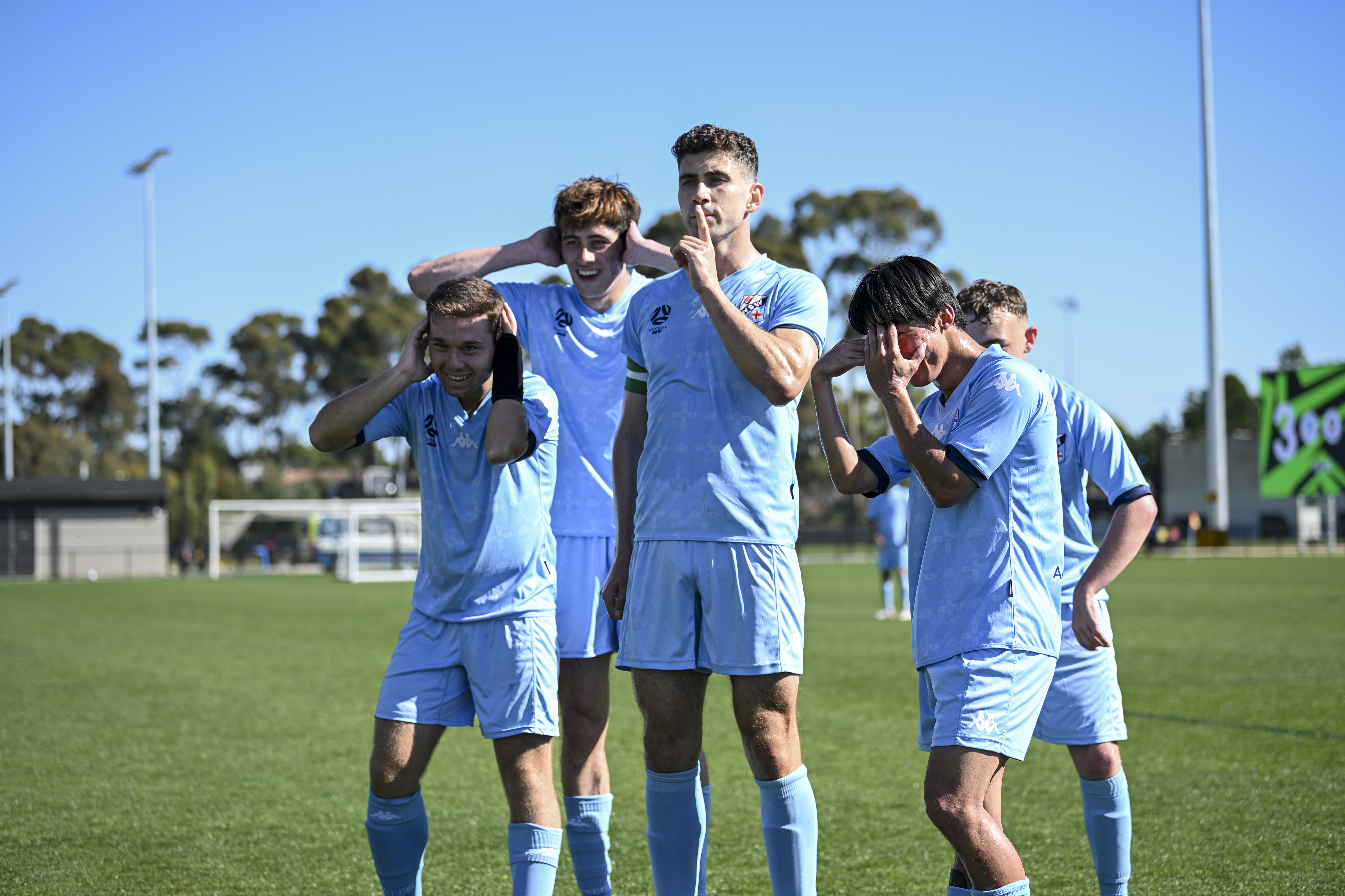 Football NSW's Augustine Murphy celebrates a goal with teammates in the Bronze Medal Match