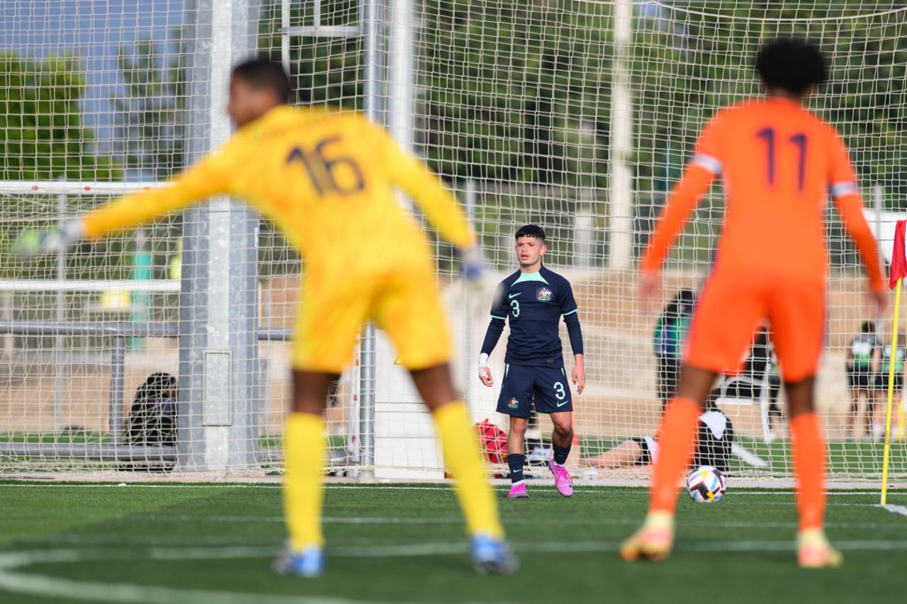 Kaylan Van Heer prepares to take a corner against the Netherlands