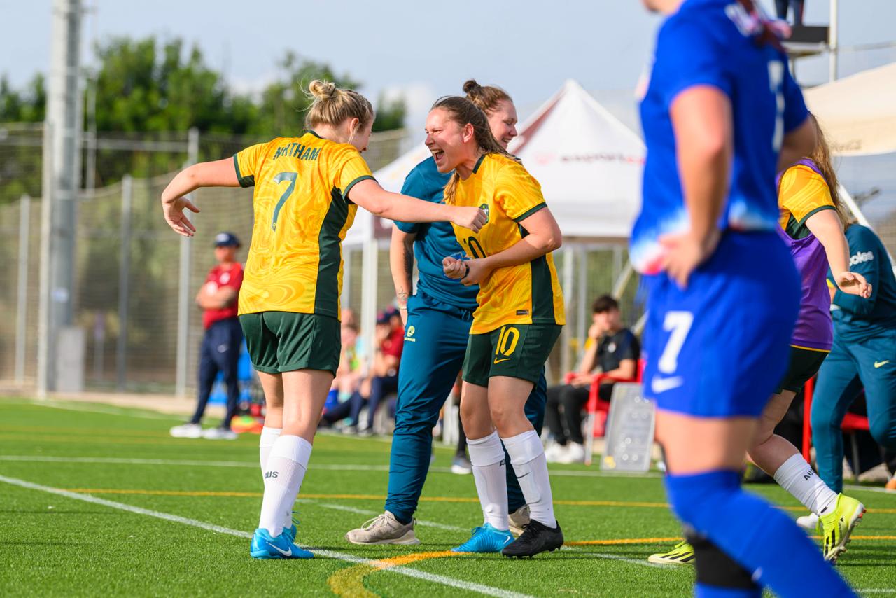 Eloise Northam celebrates her goal with Georgia Beikoff