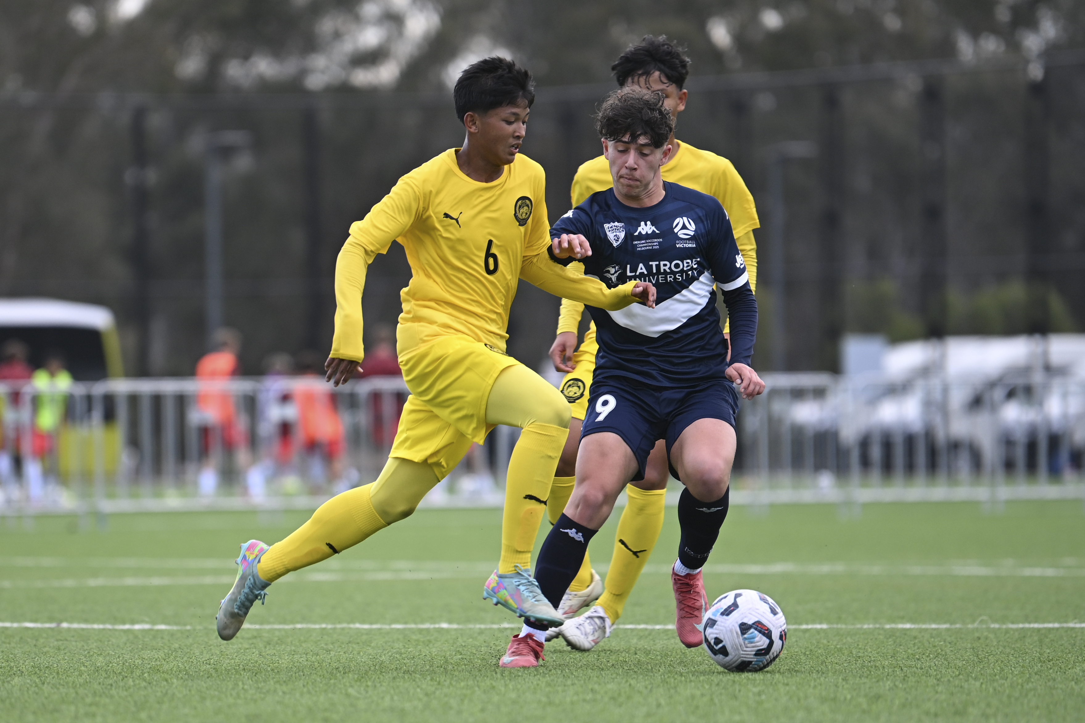 A Malaysian player takes on the defence