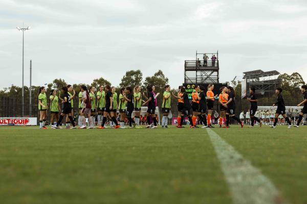 CommBank Junior Matildas shake hands with Thailand prior to the match