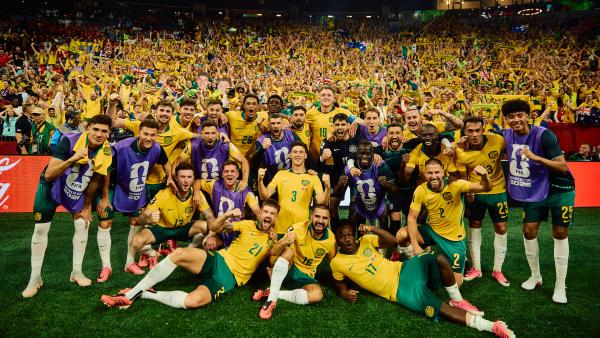 The CommBank Socceroos squad celebrating in front of their fans