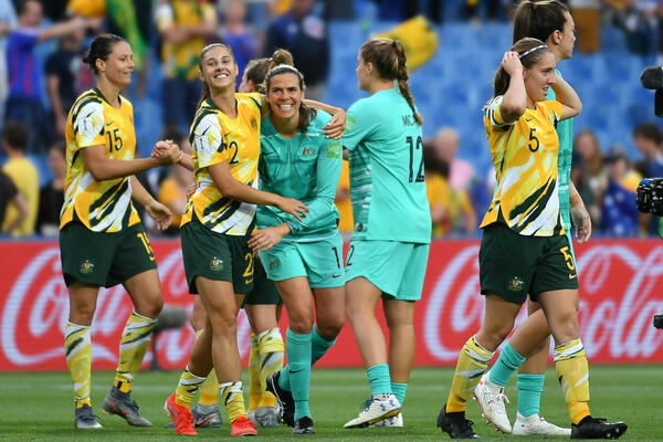Amy Harrison and Lydia Williams are all smiles as they embrace after the match